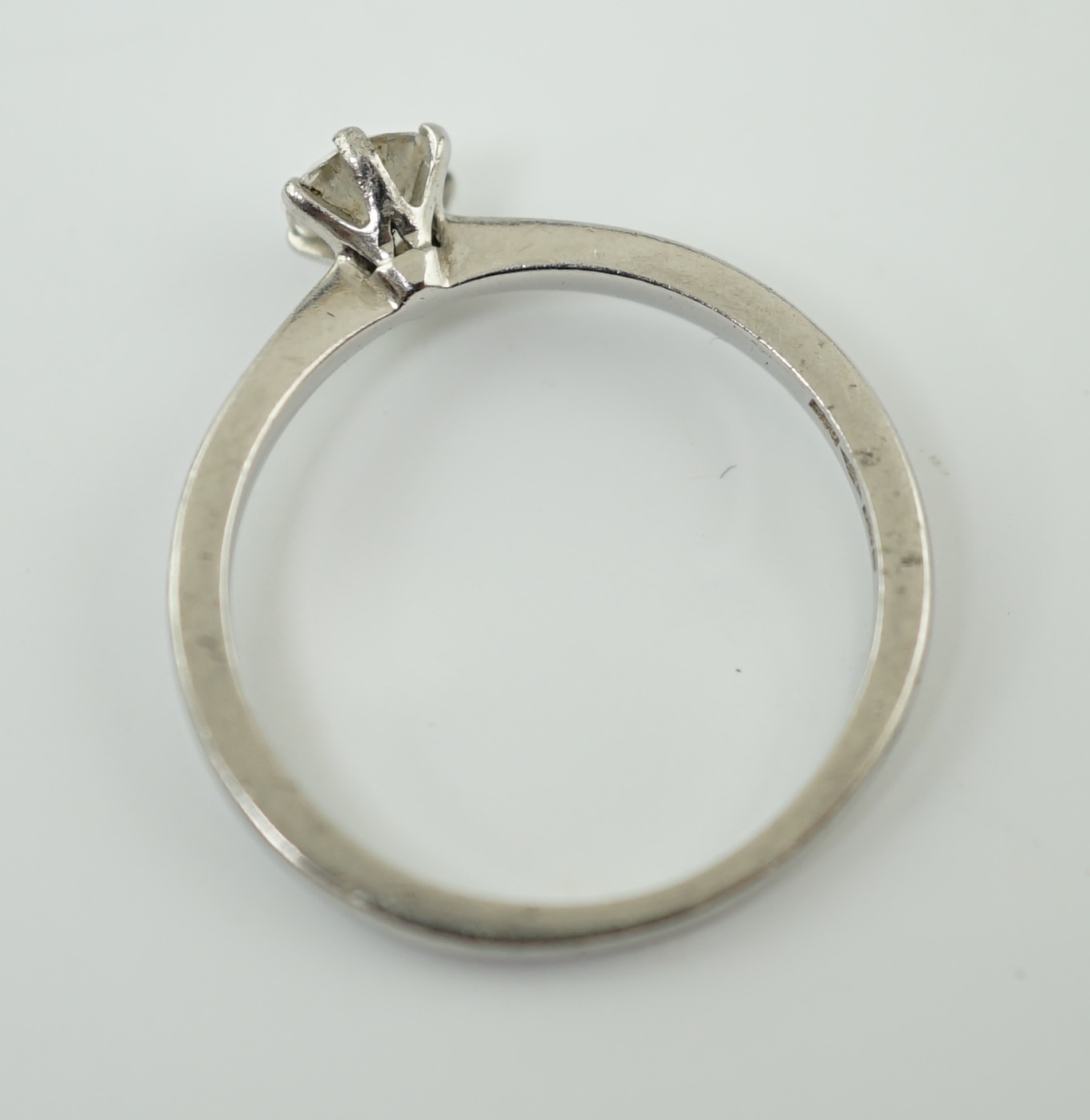 A modern platinum and solitaire diamond set ring